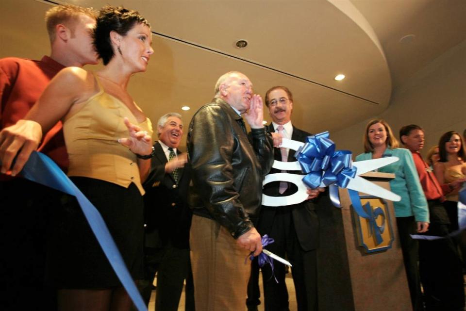 Former Biloxi Mayor A.J. Holloway, center, and casino general manager Jon Lucas cut the ribbon to reopen the IP Casino in December 2005. It was the first casino to open after Hurricane Katrina hit the Mississippi Gulf Coast.