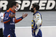 Drivers Joey Logano, left, and Chase Elliott talk following a NASCAR Cup Series auto race at Bristol Motor Speedway Sunday, May 31, 2020, in Bristol, Tenn. (AP Photo/Mark Humphrey)