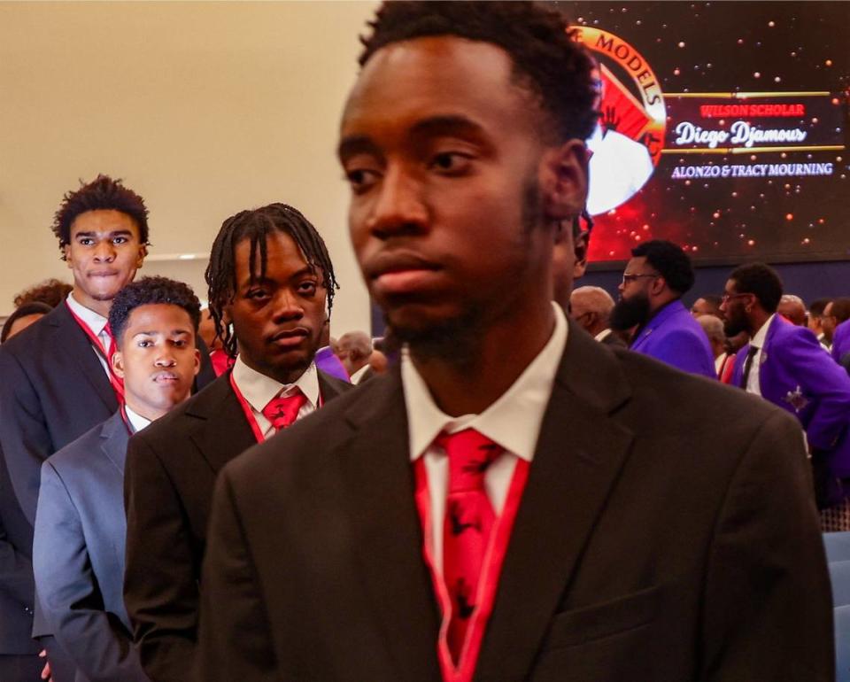 Triston Wilson, left, walks behind the Wilson Scholars during the procession before being pinned by his father, a once Wilson Scholar and now a public school administrator and Role Model for the 5000 Role Models of Excellence Project. The Wilson Scholars Academic Signing Ceremony of the 5000 Role Models of Excellence Project connected Wilson Scholars from public high schools in Miami to full scholarship support to prestigious colleges and universities during its ceremony held at the Miami Dade College-North Campus SOJ Multipurpose Room on Sunday, June 9, 2024 in Miami, Florida.