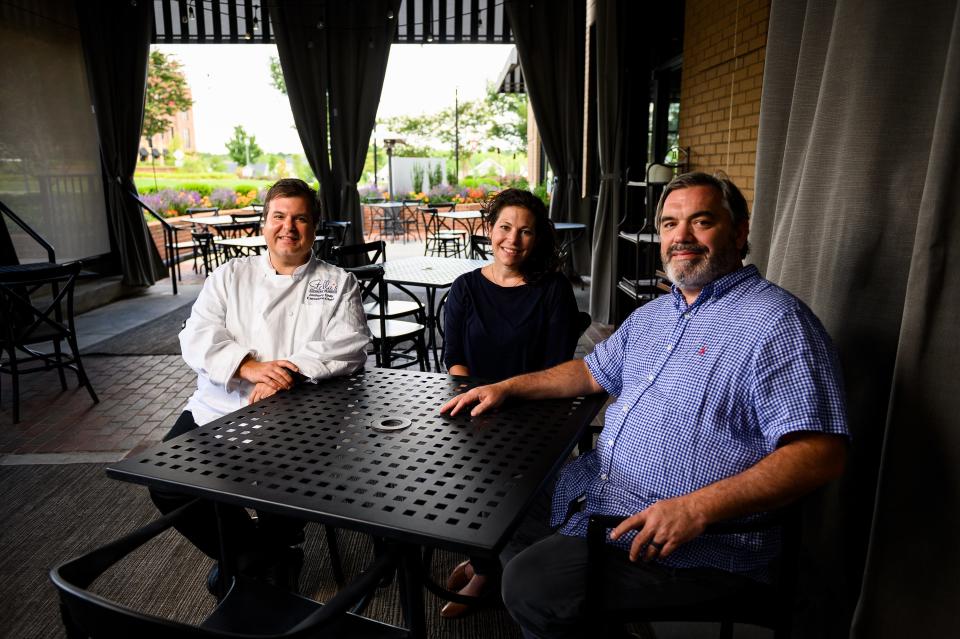 Julia and Jadon Scholz and Anthony Gray pose for a portrait at Stella's Southern Brasserie Friday, Aug. 14, 2020.