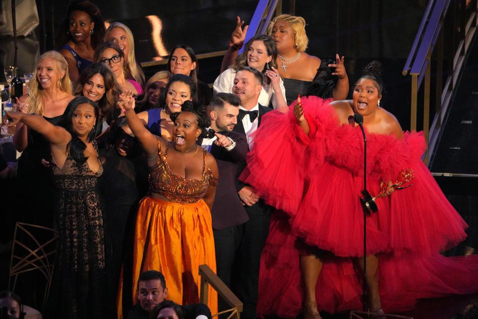 Lizzo (R) accepts Outstanding Competition Program for "Lizzo's Watch Out For The Big Grrrls" onstage during the 74th Primetime Emmys at Microsoft Theater on September 12, 2022 in Los Angeles, California.