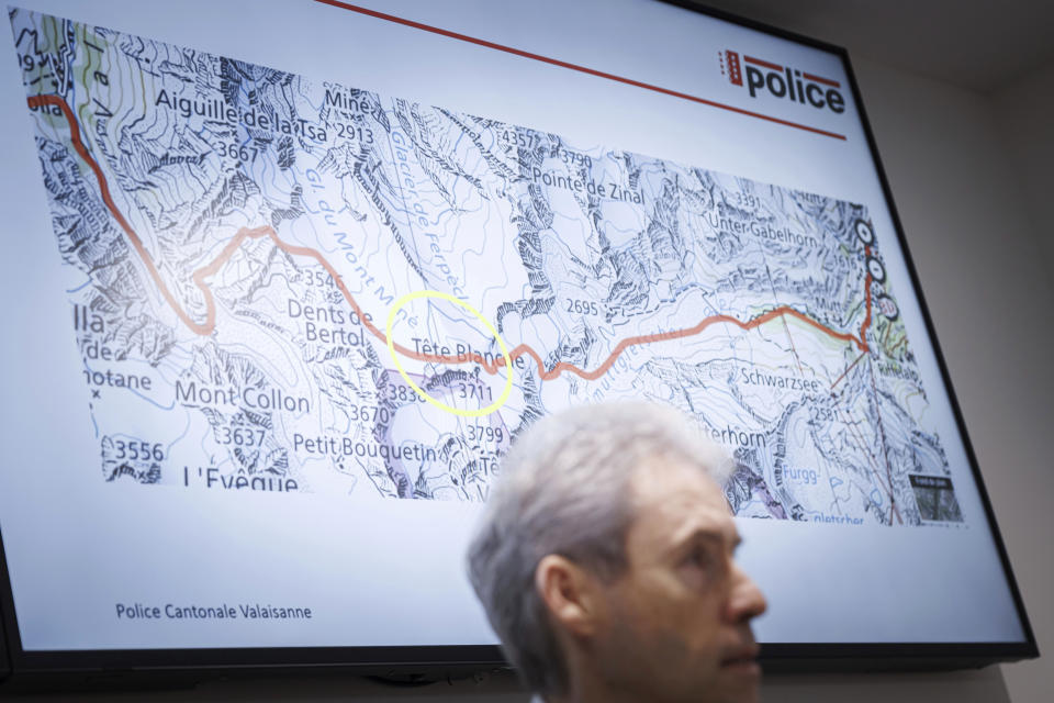 Commandant of the Valais Cantonal Police Christian Varone speaks during a press conference as a map in the background shows the location where five cross-country skiers were found dead, in Sion, Switzerland, Monday, March 11, 2024. Five cross-country skiers have been found dead after going missing over the weekend near Switzerland’s famed Matterhorn, Swiss police said Monday. Rescue authorities announced a search in difficult weather conditions Sunday for six skiers missing. The group set off Saturday on a route between the resort town of Zermatt, at the foot of the Matterhorn, and the village of Arolla, near the border with Italy. (Valentin Flauraud/Keystone via AP)