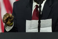 Secretary of Housing and Urban Development Ben Carson holds notes as he speaks during a campaign event before President Donald Trump at the Cobb Galleria Centre, Friday, Sept. 25, 2020, in Atlanta. (AP Photo/John Bazemore)