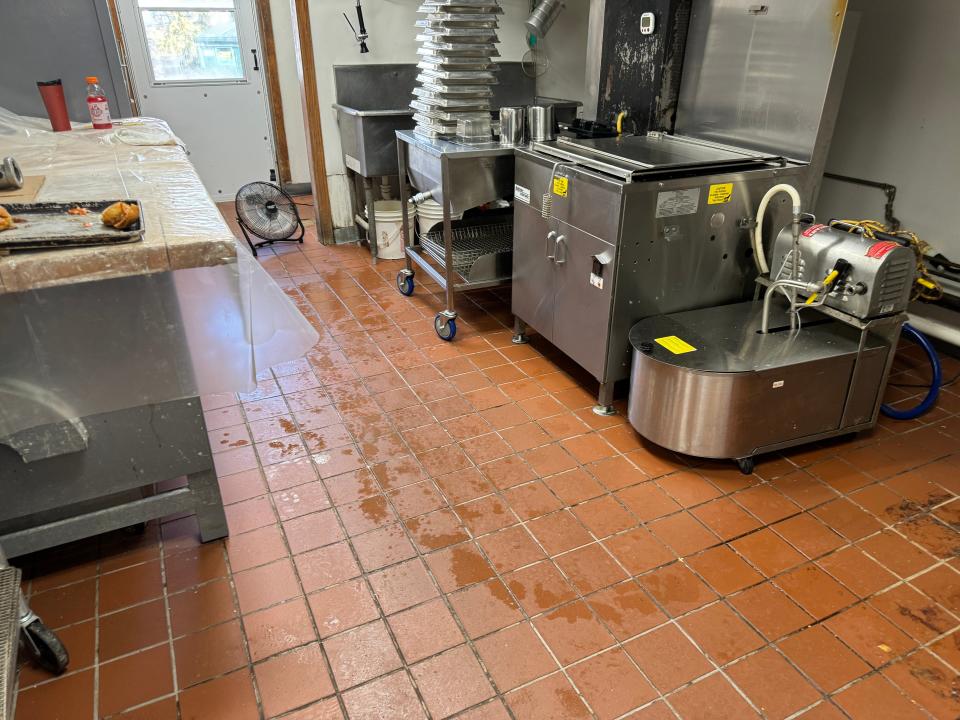 Water from the flooding of the Yantic River was still visible on the kitchen floor of Dixie Donuts in Norwich Friday morning.