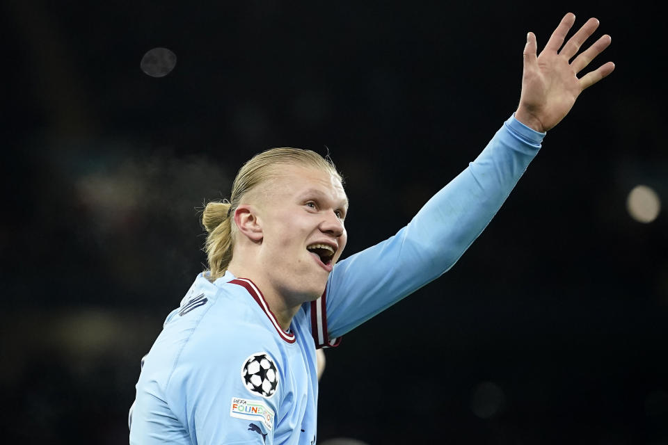 Manchester City's Erling Haaland shows five with his hand after he scored his 5th goal, the 6-0, during the Champions League round of 16 second leg soccer match between Manchester City and RB Leipzig at the Etihad stadium in Manchester, England, Tuesday, March 14, 2023. (AP Photo/Dave Thompson)