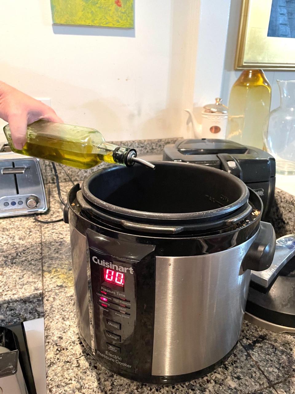 Adding olive oil for Anneta's Dad's Avgolemono Soup