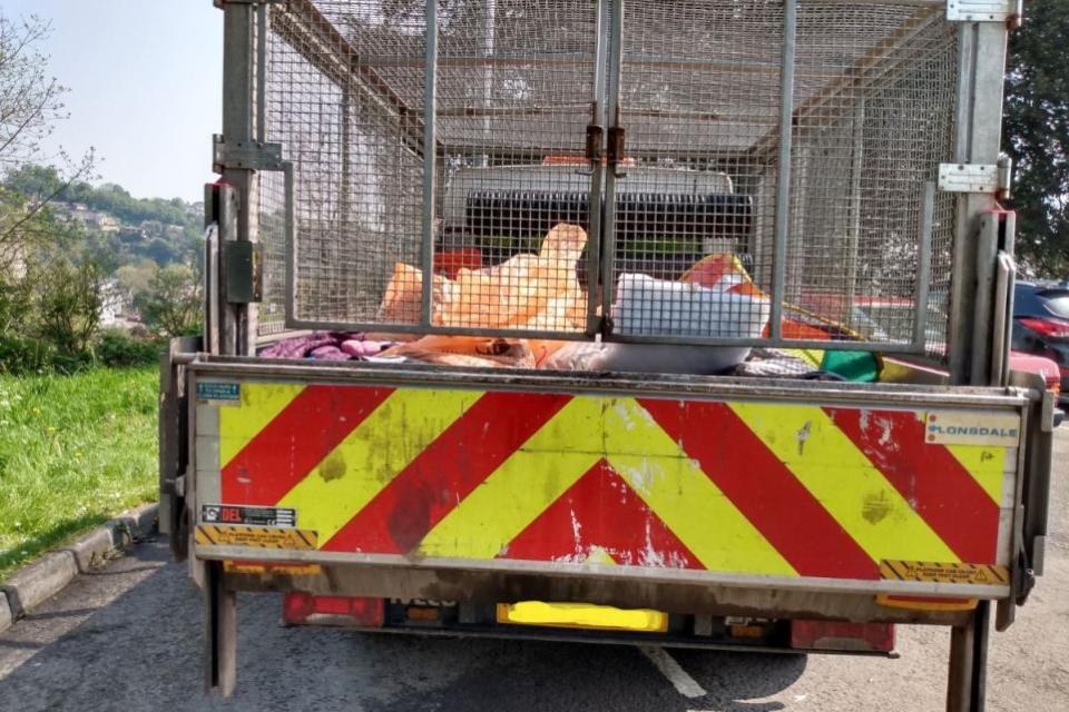 South Wales Argus:  A council van loaded with rubbish bags during a clean up operation at the Dell Car Park after it was used as a camping site by Travellers.