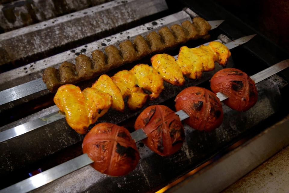 Beef, chicken and tomato are cooked on skewers, over the heat, not on a grill, at Shish Kabob.