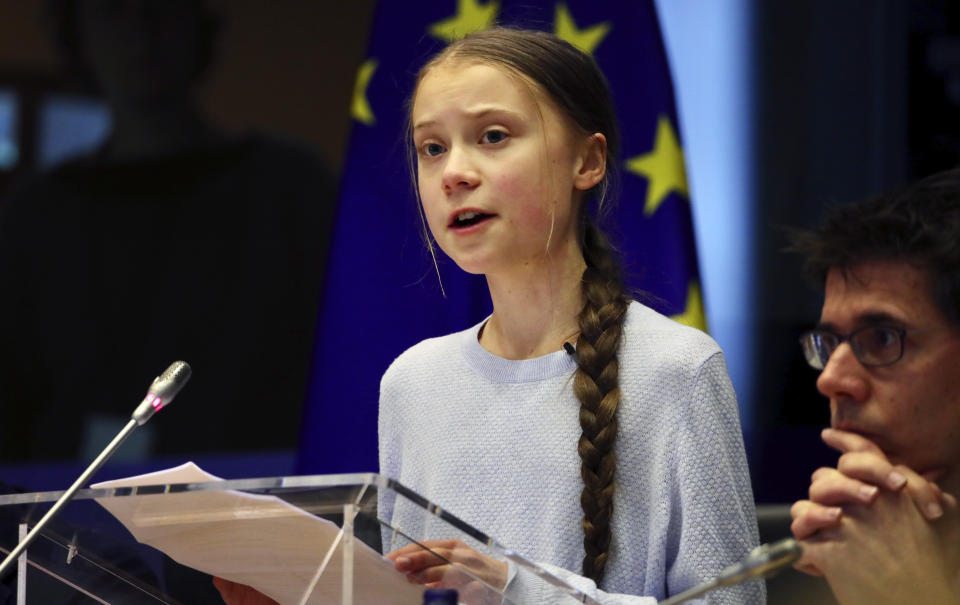 Swedish climate activist Greta Thunberg addresses a meeting of the Environment Council at the European Parliament in Brussels, Wednesday, March 4, 2020. Climate activists and Green members of the European Parliament are urging the European Union to be more ambitious as the bloc gets ready to unveil plans for a climate law to cut greenhouse gas emissions to zero by mid-century. (AP Photo/Olivier Matthys)