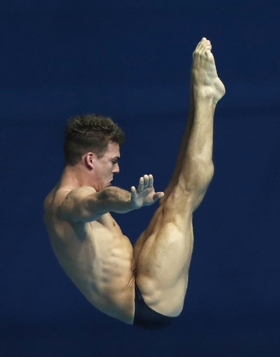 Britain's Ross Haslam performs in the mixed team event diving final at the World Swimming Championships in Gwangju, South Korea, Tuesday, July 16, 2019. (AP Photo/Lee Jin-man )