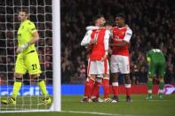 Britain Football Soccer - Arsenal v PFC Ludogorets Razgrad - UEFA Champions League Group Stage - Group A - Emirates Stadium, London, England - 19/10/16 Arsenal's Mesut Ozil celebrates scoring their sixth goal and his hat trick with team mates Reuters / Toby Melville Livepic