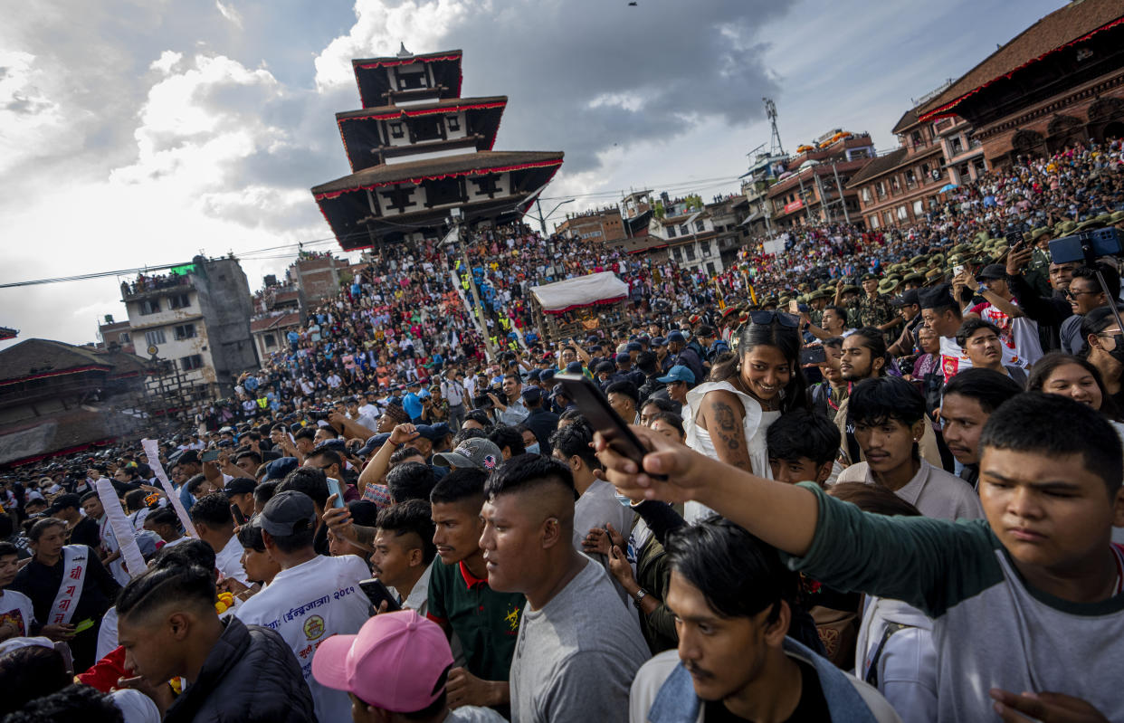 Devotees gather to watch the annual Indra Jatra festival that marks the end of the rainy season in Kathmandu, Nepal, Tuesday, Sept. 17, 2024. (AP Photo/Niranjan Shrestha)