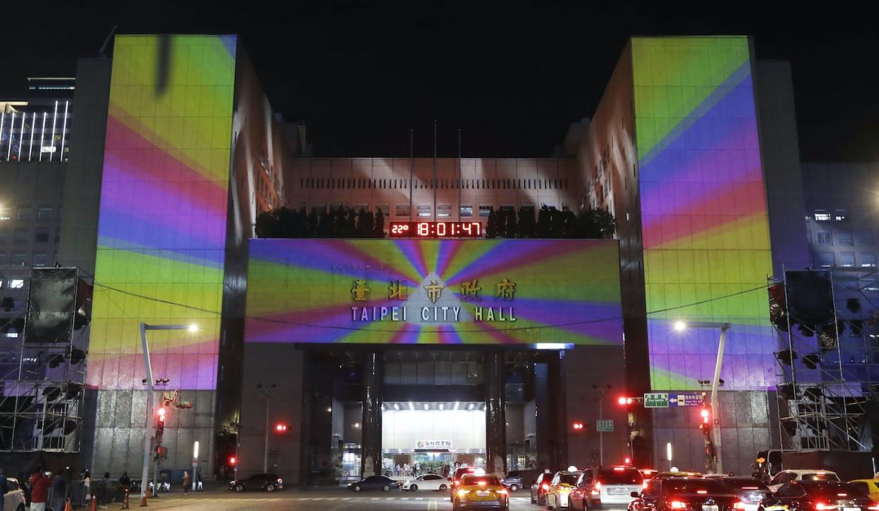 The Taipei city hall building is lit up with Pride colours during the annual Taiwan LGBTQ event in Taipei, Taiwan, in October 2021. (AP Photo/Chiang Ying-ying)