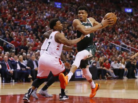 May 21, 2019; Toronto, Ontario, CAN; Milwaukee Bucks forward Giannis Antetokounmpo (34) controls the ball as Toronto Raptors guard Kyle Lowry (7) defends during game four of the Eastern conference finals of the 2019 NBA Playoffs at Scotiabank Arena. Mandatory Credit: John E. Sokolowski-USA TODAY Sports