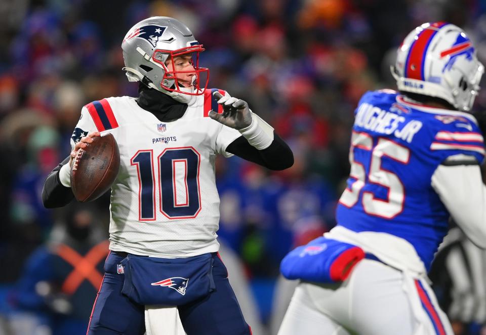 Patriots quarterback Mac Jones drops to pass during the second quarter of the AFC wild-card playoff game against the Bills on Saturday in Buffalo.