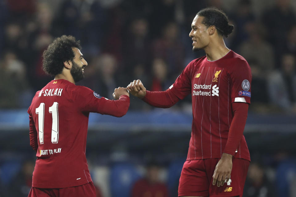 Mohamed Salah (left), Virgil van Dijk and Liverpool remain every bit as dangerous as they were last season. (AP Photo/Francisco Seco)