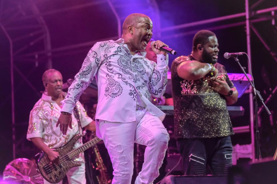 In 2022, founding member Robert "Kool" Bell (left) performed with Kool & the Gang at Britain's Boomtown Fair Fest.