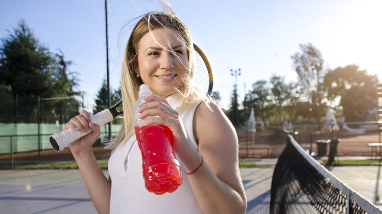 tennis player with sports drink