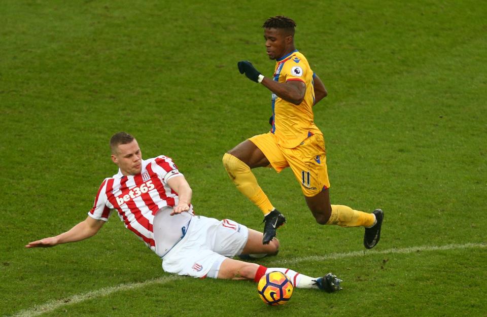 <p>Stoke City’s Ryan Shawcross (left) tackles Crystal Palace’s Wilfried Zaha</p>