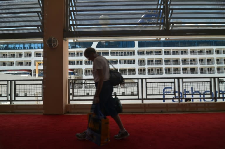 Passengers prepare to board the Fathom cruise ship Adonia as she as she departs Miami Beach, Florida on her inaugural seven-day voyage to Cuba on May 1, 2016