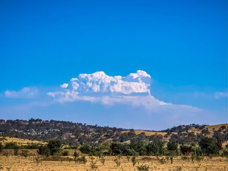 Fire clouds are formed over the mountains' range near Bredbo