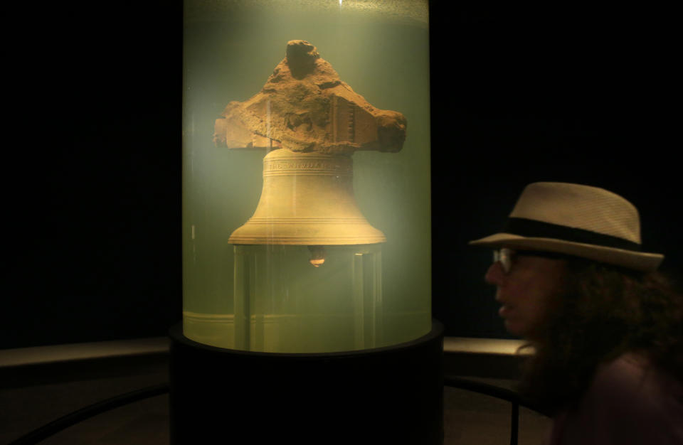 In this 2016 file photo, a museum visitor walks by a display of a bell once belonging to the pirate ship Whydah Gally at the Whydah Pirate Museum, in Yarmouth, Mass.  (Photo: ASSOCIATED PRESS)