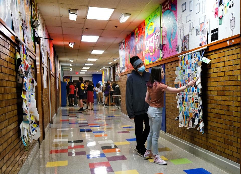Eighth grade art students look at past murals in the halls, which as eighth graders they will get to create their own this year. Classen SAS Middle School. First day of Oklahoma City Public Schools. Thursday, Aug. 10, 2023
