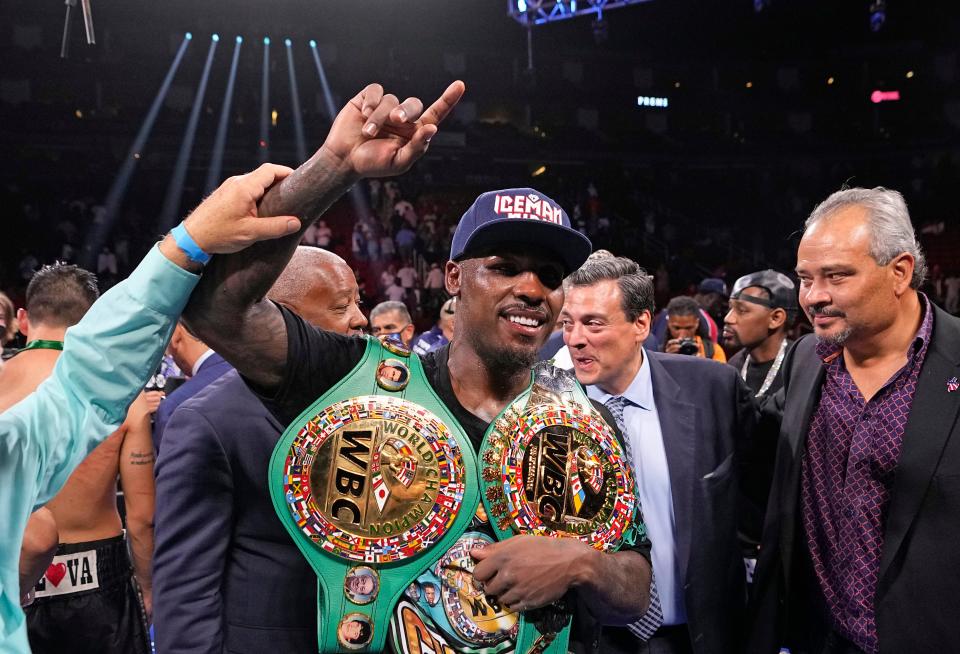 Jermall Charlo poses with his championship belts after beating Juan Macias Montiel in a WBC middleweight world championship boxing match Saturday, June 19, 2021, in Houston. (AP Photo/David J. Phillip)