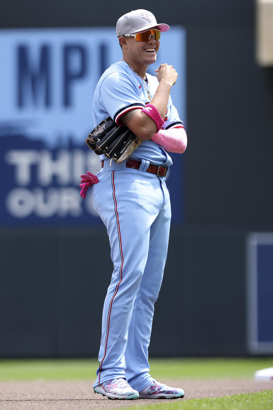 Minnesota Twins second baseman Jose Miranda (64) smiles on the field during the first inning of a baseball game against the Oakland Athletics, Sunday, May 8, 2022, in Minneapolis. (AP Photo/Stacy Bengs)