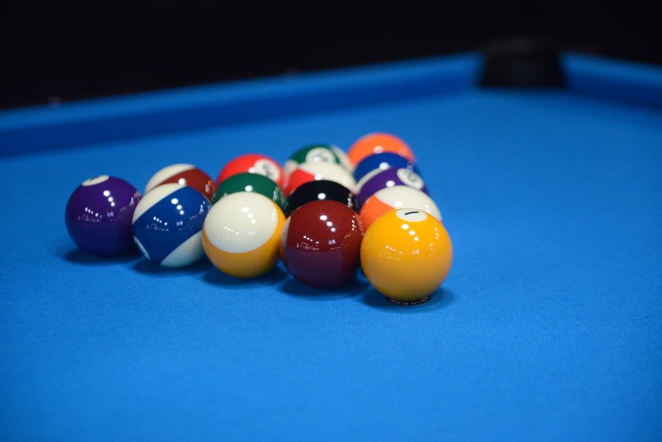 Billiard balls set up on a pool table in the back of The Local Smokey. June 7, 2023.