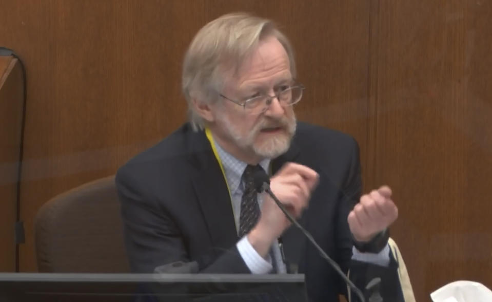 In this image from video, Dr. Martin Tobin testifies as Hennepin County Judge Peter Cahill presides before the court Thursday, April 15, 2021, in the trial of former Minneapolis police Officer Derek Chauvin at the Hennepin County Courthouse in Minneapolis, Minn. Chauvin is charged in the May 25, 2020 death of George Floyd. (Court TV via AP, Pool)