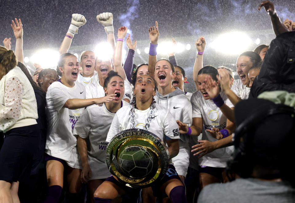 Oct 6, 2024; Orlando, Florida, USA; Orlando Pride forward Marta (10) holds the 2024 NWSL Shield awarded to them at the end of their match against Washington Spirit at Inter&Co Stadium. Mandatory Credit: Mike Watters-Imagn Images