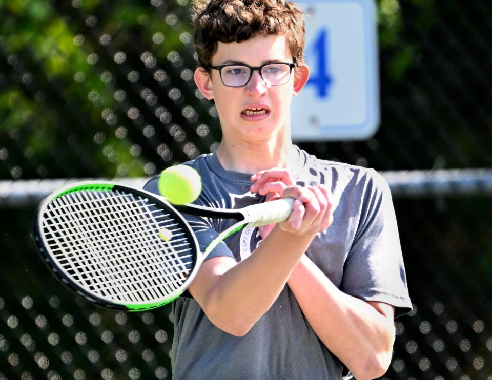 Cape Cod Academy number one doubles player Connor Hall forehands a shot at his Sturgis opponents.