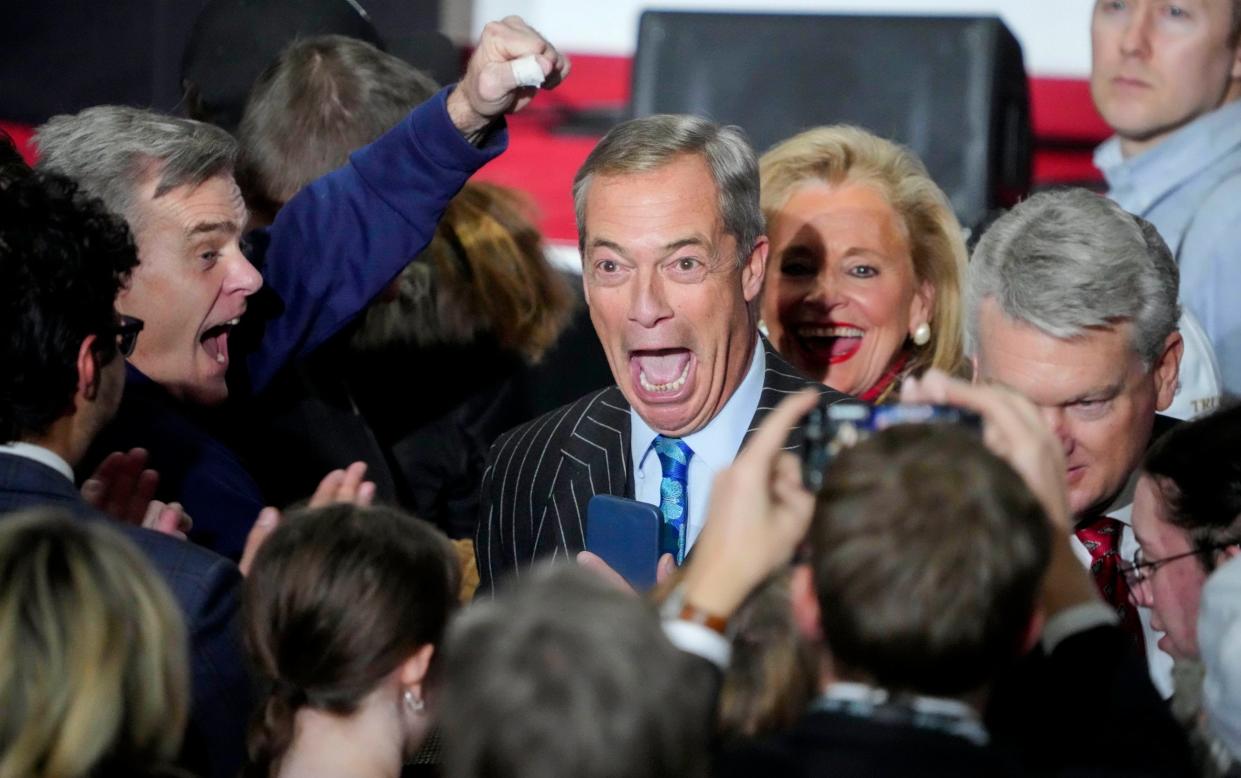 Nigel Farage reacts to Donald Trump’s win at his caucus night watch party on Monday