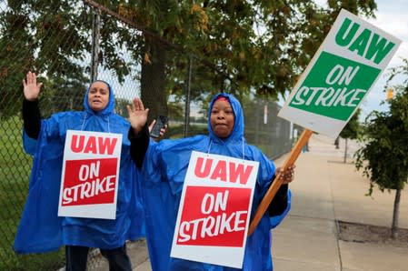 United Auto Workers, Aramark workers, carry strike signs outside the General Motors Detroit-Hamtramck assembly plant in Detroit,