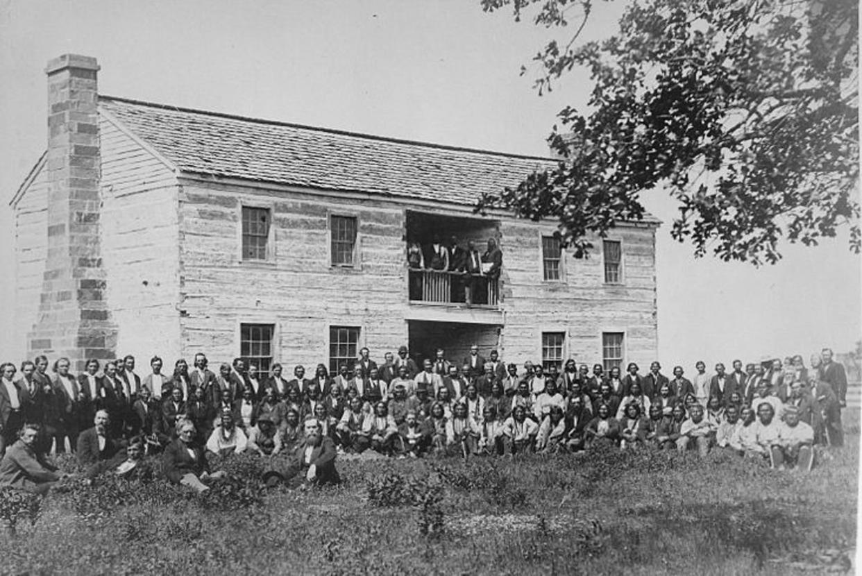 <span class="caption">Delegates from 34 Native tribes at the Creek Council House in Indian Territory, now called Oklahoma, 1880.</span> <span class="attribution"><a class="link " href="https://upload.wikimedia.org/wikipedia/commons/b/bf/Delegates_from_34_tribes_in_front_of_Creek_Council_House%2C_Indian_Territory%2C_1880_-_NARA_-_519141.jpg" rel="nofollow noopener" target="_blank" data-ylk="slk:National Archives;elm:context_link;itc:0;sec:content-canvas">National Archives</a></span>