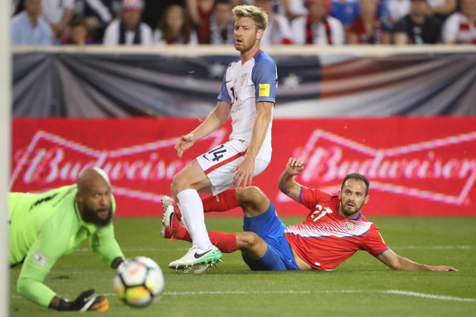 It was a rought night for Tim Ream (14), Tim Howard (bottom left) and the U.S. national team. (Getty)