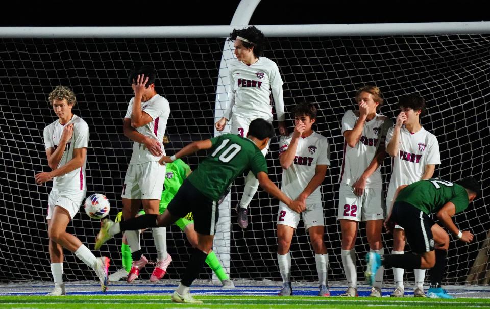 San Luis player Misael Meza (10) shoots from a free kick against Perry during the 6A Championship game at Dobson High School in Mesa on Feb. 25, 2023.