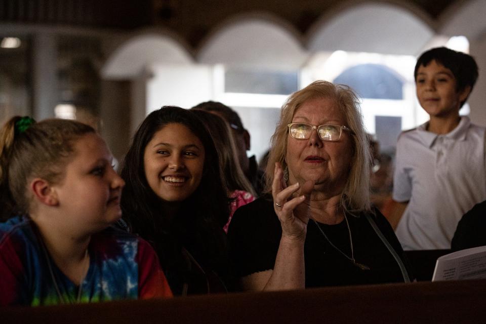 An audience member watches the Boar's Head and Yule Log Festival at First Christian Church on Saturday, Jan. 7, 2023, in Corpus Christi, Texas.