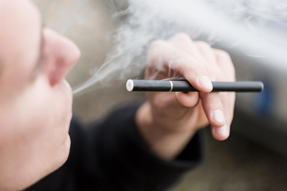 Smoking E-Cigarette (Getty Images stock)