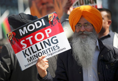 Demonstrators stage a protest against the visit by India's Prime Minister Narendra Modi in Parliament Square, London, Britain, April 18, 2018. REUTERS/Hannah McKay