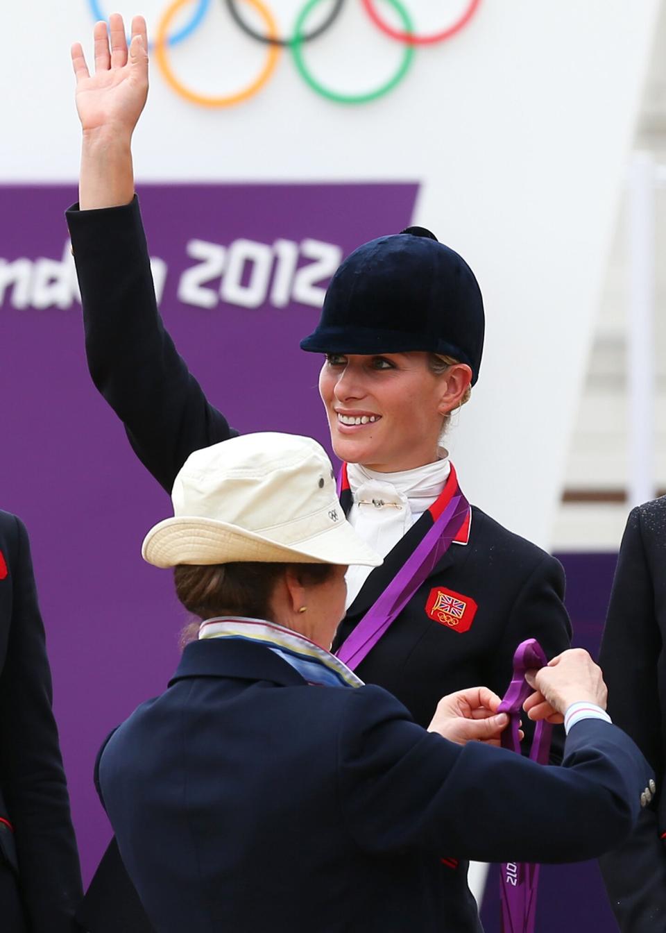 Zara Phillips is presented a silver medal by her mother, Princess Anne, Princess