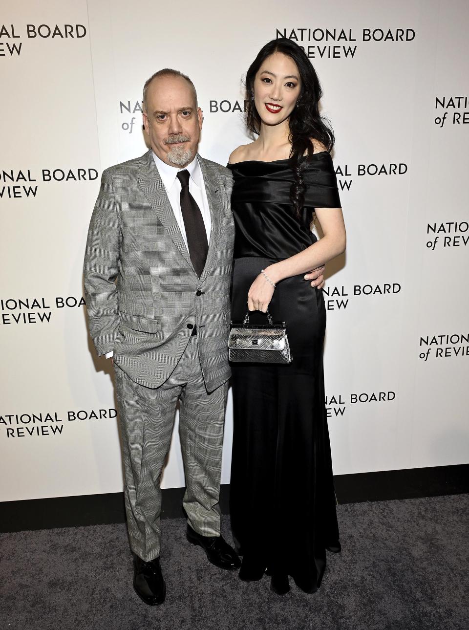 Best actor honoree for "The Holdovers" Paul Giamatti, left, and girlfriend Clara Wong attend the National Board of Review awards gala at Cipriani 42nd Street on Thursday, Jan. 11, 2024, in New York. (Photo by Evan Agostini/Invision/AP)