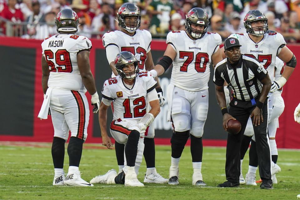 Tampa Bay Buccaneers' Tom Brady gets up after being sacked during the second half of an NFL football game against the Green Bay Packers Sunday, Sept. 25, 2022, in Tampa, Fla. (AP Photo/Chris O'Meara)