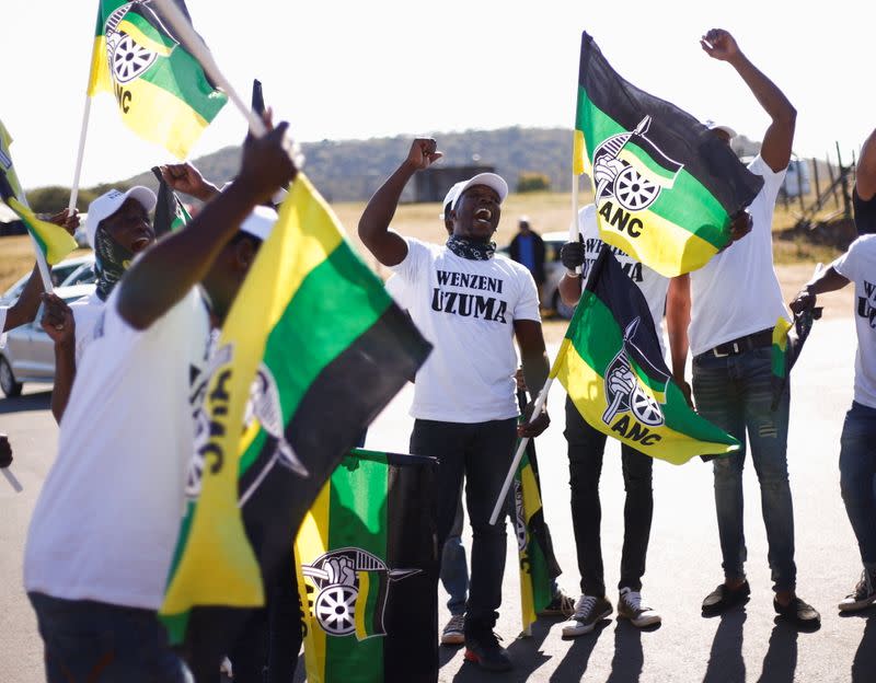 Supporters of former South African President Zuma sing and dance in front of his home following his sentencing, in Nkandla