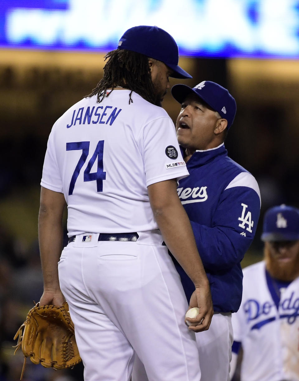 Los Angeles Dodgers manager Dave Roberts, right, talks to relief pitcher Kenley Jansen during the ninth inning of a baseball game against the San Francisco Giants, Thursday, June 20, 2019, in Los Angeles. (AP Photo/Mark J. Terrill)