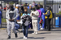 Fans arrive at Hale Stadium for an NCAA college football game between Tennessee State and Southeast Missouri State on Sunday, April 11, 2021, in Nashville, Tenn. Because of COVID-19, the OVC postponed the 2020 season to the spring, and the decision was made to play games on Sunday because member schools needed flexibility to staff all the spring sports. (AP Photo/Mark Humphrey)