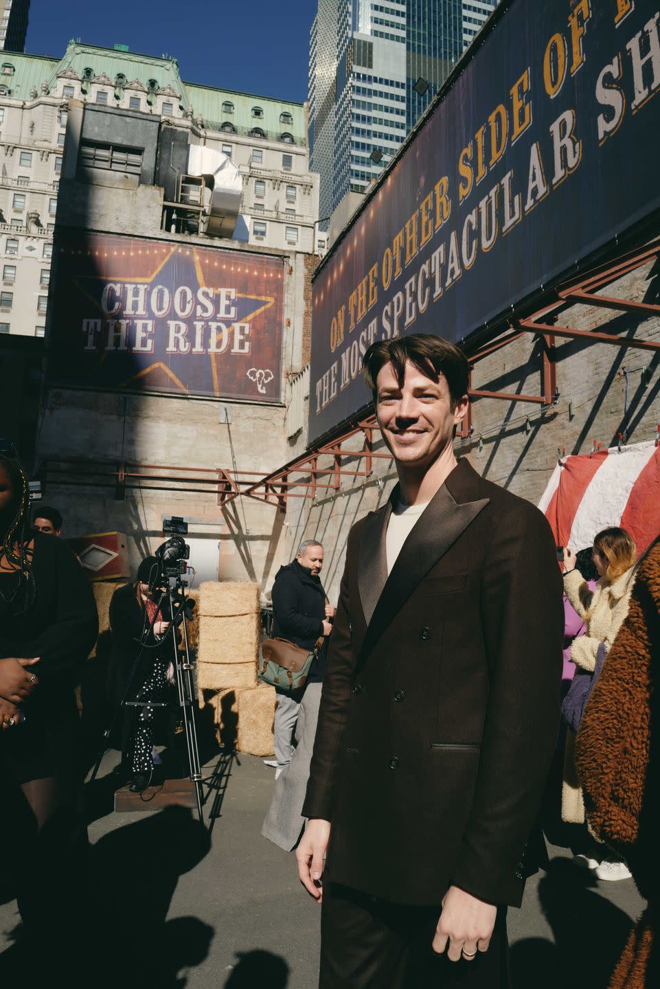 a man standing in front of a sign