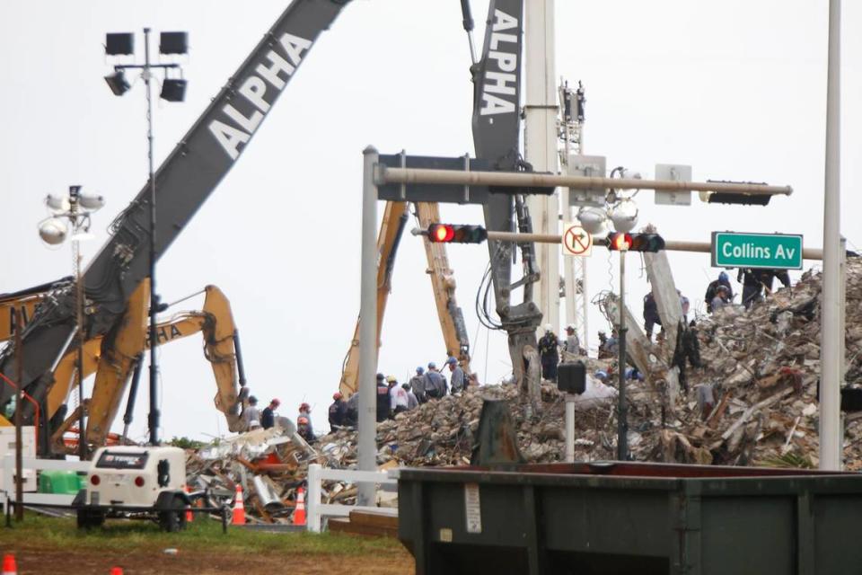 Search and rescue workers continue working at the site of the demolished Champlain Towers South in Surfside on Monday evening, July 5, 2021.