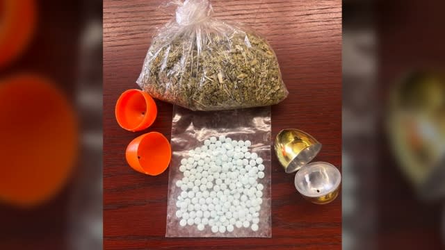 More than 170 pills of fentanyl, a bag of "spice" and two plastic eggs are shown.